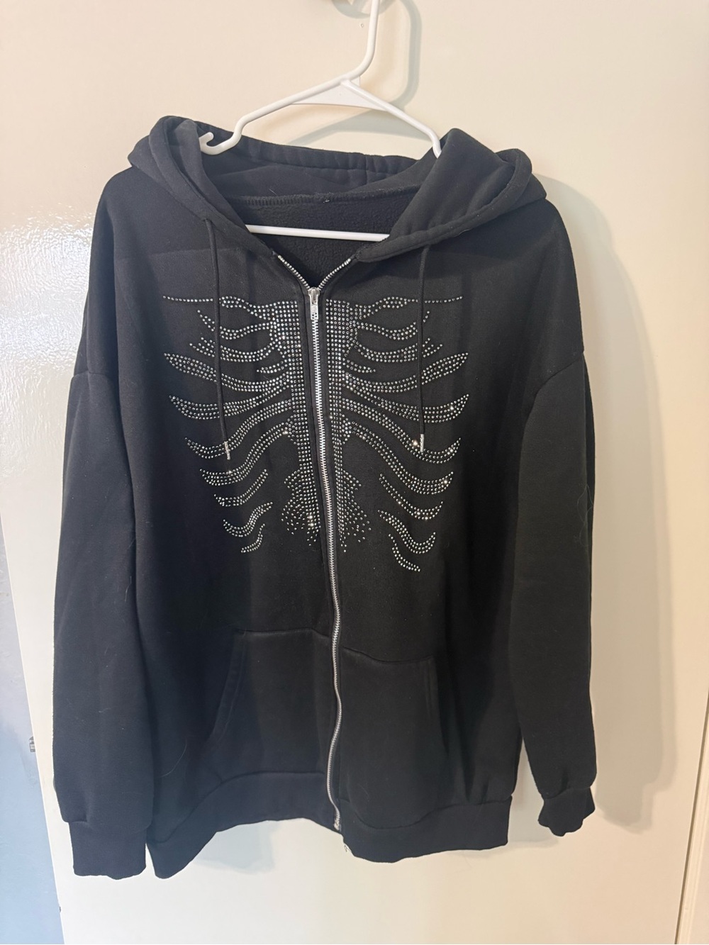 Black Zip-Up Hoodie with Rhinestone Rib Cage Design
